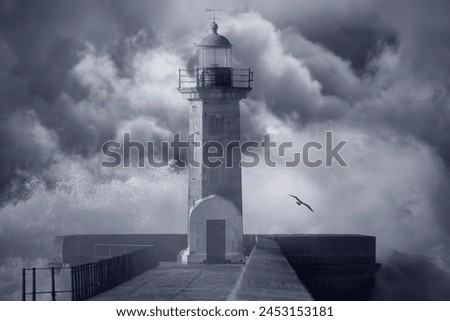 Old lighthouse against an enhanced cloudy stormy sky. Converted Black and white. Tone blue.