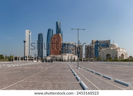 A picture of the Etihad Towers, the Khalidiya Palace Rayhaan by Rotana Hotel, the Abu Dhabi National Oil Company Headquarters and one Qasr Al Watan Gateway as seen from a nearby parking lot.
