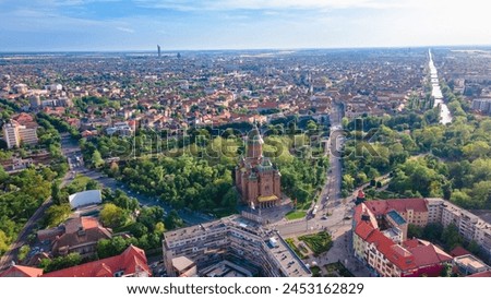 Aerial view of the beautiful city of Timisoara, Romania. Photography was shot from a drone at a higher altitude with the Mitropolitan Cathedral and the parks in the view. Royalty-Free Stock Photo #2453162829