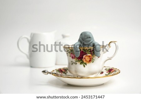 Manatee in Floral Teacup with saucer, milk and sugar