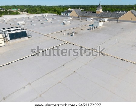 Drone Images of TPO Commercial Roof With Some Metal Panels and a Clock Cupola  Royalty-Free Stock Photo #2453172397
