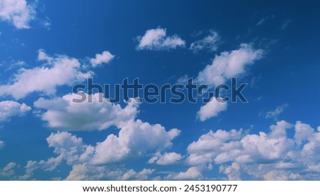 Pink Clouds Against Blue Sky At Sunset. Sunrise Clouds Are In Pink Vanilla Colours. Royalty-Free Stock Photo #2453190777
