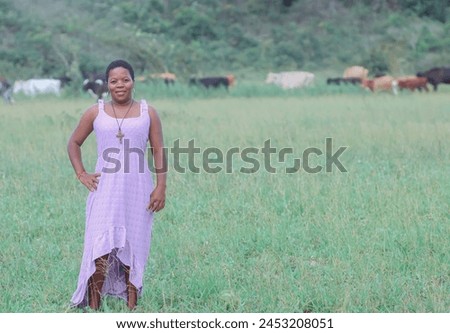Black woman, from the Northeast representing the Northeast of Brazil. she is in a natural environment, contemplating nature and giving thanks. Royalty-Free Stock Photo #2453208051