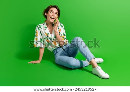 Full body size photo of sit good mood girl calling using her smartphone roaming service look copyspace isolated on green color background