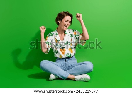 Full body picture of gorgeous young woman bob hair raised fists up celebrate she went vacation abroad isolated on green color background