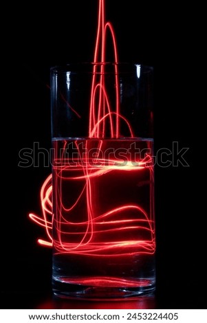 red light painting in a glass lightning