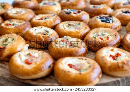 coffee break hotel during conference meeting, corporate revent with tea and coffee catering, decorated catering banquet table with variety of different pastry and bakery, with croissants and cookies Royalty-Free Stock Photo #2453233329