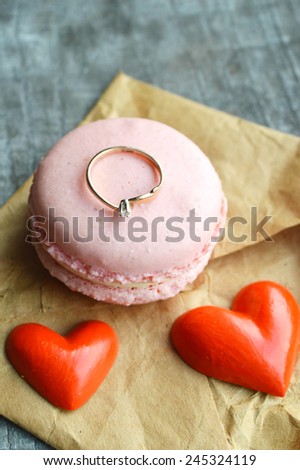 pink French macarons heart-shaped .love letter,Valentine,proposal,ring,red hearts,Valentine's day.wooden background