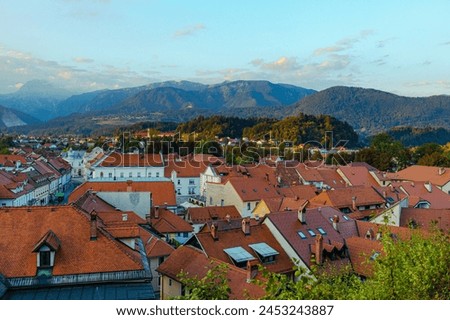 Mountains and Red Roofs of Kamnik Town under the Kamnik-Savinja Alps, Slovenia Royalty-Free Stock Photo #2453243887