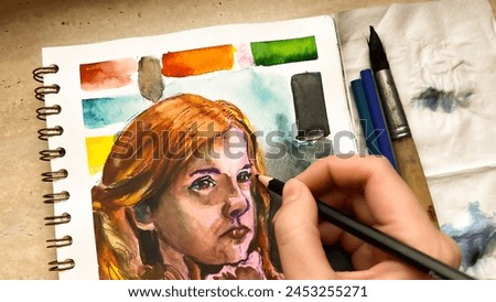 Drawing portrait of girl with red hair using watercolor and color pencils. Painting in sketchbook. Sketching thoughtful female person. Limited color palette. Soft focus. film grain pixel texture. 