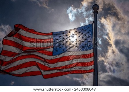 American election and vote concept. US Flag. Waving american flag on dark dramatic sky. USA flag. Grunge American flag.