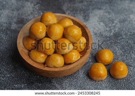 Nastar Cookies, Pineapple tarts or nanas tart are small, bite-size pastries filled or topped with pineapple jam, commonly found when Hari Raya or Eid Al Fitr or Lebaran. Selective focus. Royalty-Free Stock Photo #2453308245