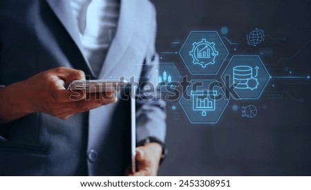  Business success insights of stock market, currency exchange rate and economics data analysis concept of investor wearing a suit with glowing graphics and icons.