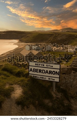 Aberdaron village road sign in evening sunlight. Aberdaron is on the coast of the Llyn Peninsula in Gwynedd.