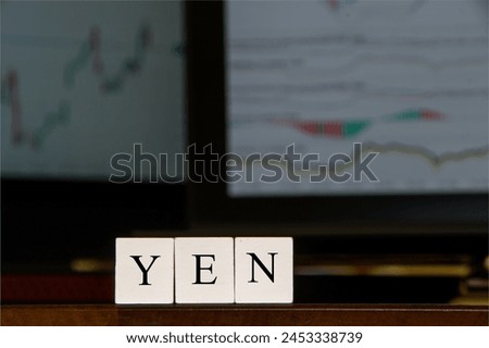  Japanese currency YEN in business setting, computer screens, displaying financial graphs, commerce image.