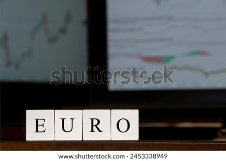 Euro, commerce and currency markets and exchange desk. Business setting, computer screens, displaying financial graphs.