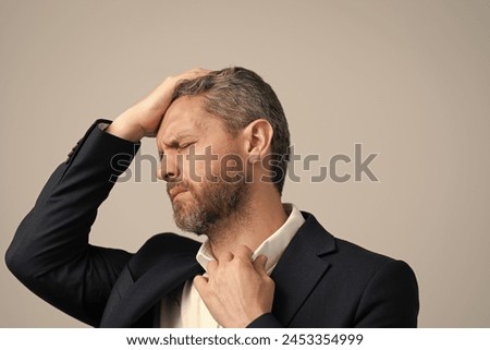 Head pain migraine. Business man in suit with migraine. Business man got migraine touches her head because of pain. Tired exhausted man suffering from headache. Business problems. cephalalgia Royalty-Free Stock Photo #2453354999