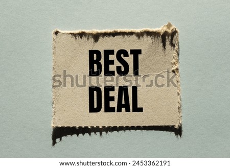 Best deal words written on ripped paper piece with gray background. Conceptual best deal symbol. Copy space.