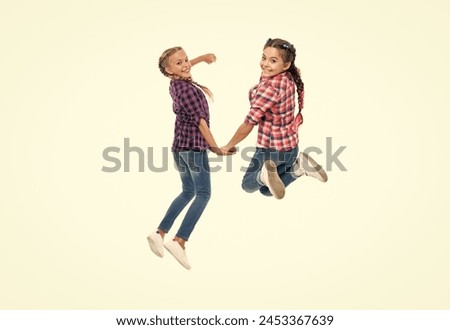 happy girls sisterhood. children have fun together. bond of sisterhood and friendship. girls friends having fun and jumping. friendship of two children. sisters in friendship provide support Royalty-Free Stock Photo #2453367639