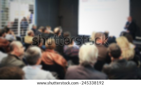 People during a meeting. Intentionally blurred post production.
