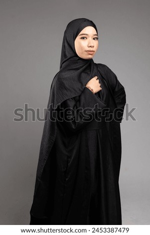 Cute women wearing hijab and Abaya over white background.