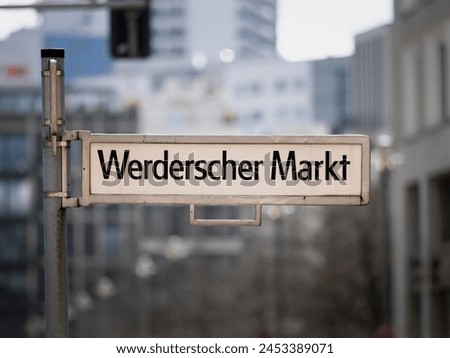 Werderscher Markt square sign in Berlin. Location name guide at a historical place in the old district Mitte. German language on the signage.