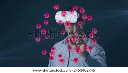 Image of network of connections with icons over man wearing vr headset and data processing. global data processing, digital interface, technology and networking concept digitally generated vide