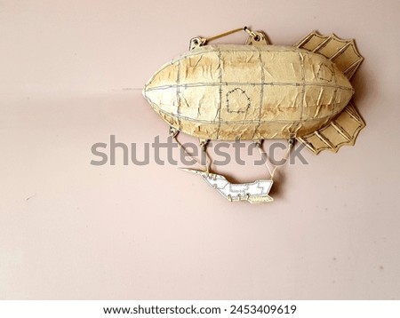 retro airship toy on a white background. vintage airship toy Royalty-Free Stock Photo #2453409619
