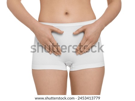 Woman holding hands near panties on white background, closeup. Women's health