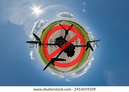 No drone zone sign concept for banning the use of drones in airspace. drone silhouette in red circle with crossed out stripe on tiny planet ?? blue sky like background