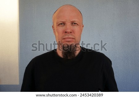 Men's beard. The guy's face is large. Brutal macho. Mustache and beard. Barber. Lumberjack. Portrait of a handsome man with a beard                                Royalty-Free Stock Photo #2453420389