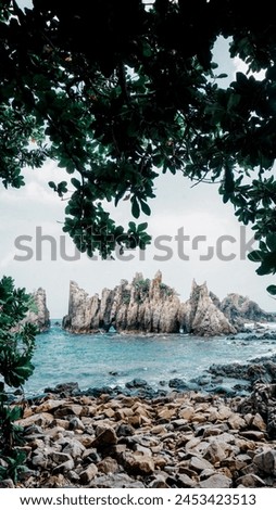 The beach, which has distinctive coral rocks, looks very sturdy and has character. Local residents know it as shark's tooth beach (Pantai Gigi hiu). lampung, Indonesia, may 10, 2018