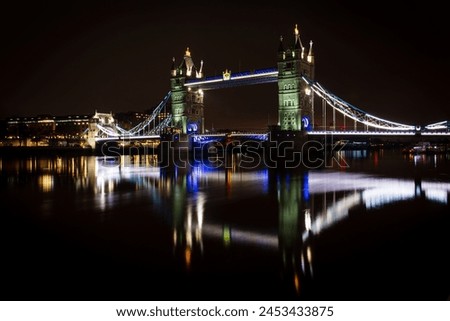 Tower Bridge and reflections in the River Thames at night, London, England, United Kingdom, Europe