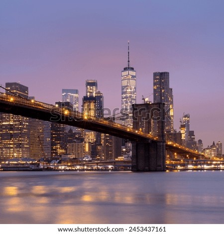 Brooklyn Bridge and Lower Manhattan skyline at dawn, New York City, New York, United States of America, North America