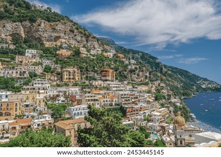 Sunny view of Positano low-rise buildings with church and cliffs, Positano, Costiera Amalfitana (Amalfi Coast), UNESCO World Heritage Site, Campania, Italy, Europe Royalty-Free Stock Photo #2453445145