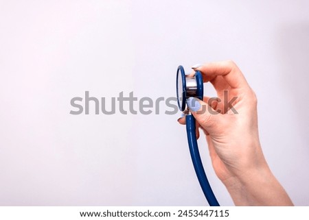 Woman hand is holding  stethoscope
