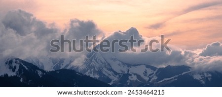 Panoramic photography of winter sunset on the top of the mountains