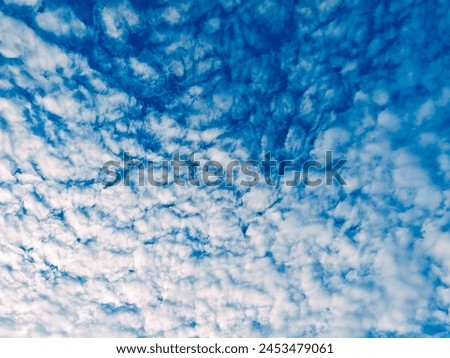The view of the sky filled with clouds like white cotton Royalty-Free Stock Photo #2453479061