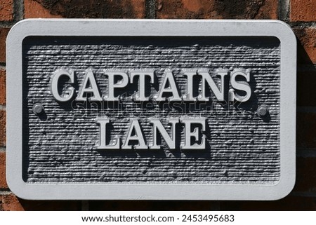 A sign that says Captians Lane.