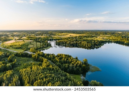 Beautiful aerial view of lake Galve, one of most popular lakes among water-based tourists, divers and holiday makers, located in Trakai, Lithuania. Royalty-Free Stock Photo #2453503565