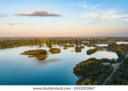 Beautiful aerial view of lake Galve, one of most popular lakes among water-based tourists, divers and holiday makers, located in Trakai, Lithuania. Royalty-Free Stock Photo #2453503867
