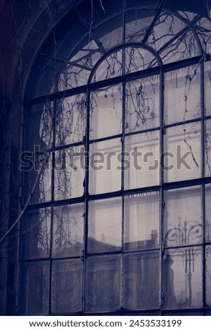 Halloween window background, an ominous night window with a shadow from the house. Book cover design with space to copy. High quality photo