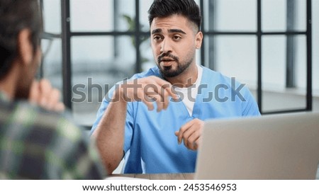 Doctor talking to a patient in a consultation at the office