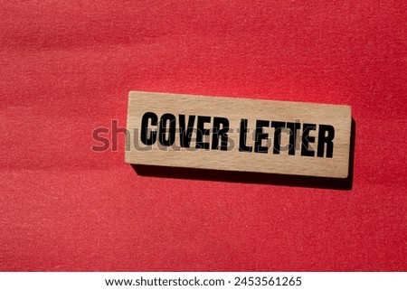 Cover letter words written on wooden block with red background. Conceptual cover letter symbol. Copy space.