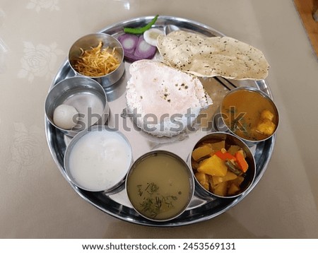 Indulge in a sumptuous dal sabji thali in Paro, a feast for the senses brimming with aromatic spices, vibrant colors, and flavors that evoke the essence of Bhutanese cuisine. Royalty-Free Stock Photo #2453569131