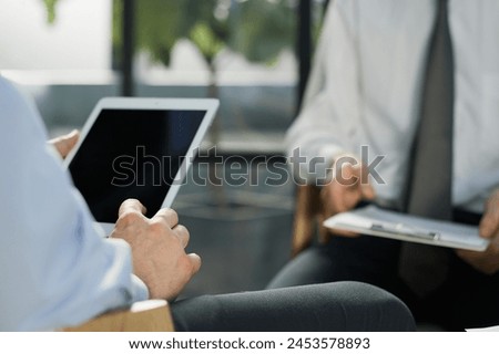 senior businessman holding tablet, signing online successful contract