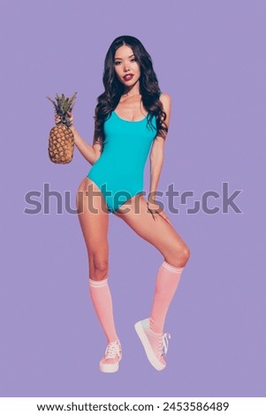 Vertical full length body size portrait of sweet girlish gorgeous charming slim thin fit wavy-haired lady red lips shoes sneakers footwear holding ananas in hand isolated on pink background