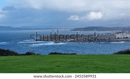 Skyline of the city of Coruña, with the Tower of Hercules in the background, with a day of sun and clouds