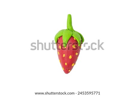 Plasticine molded into red strawberry Isolated on a white background.