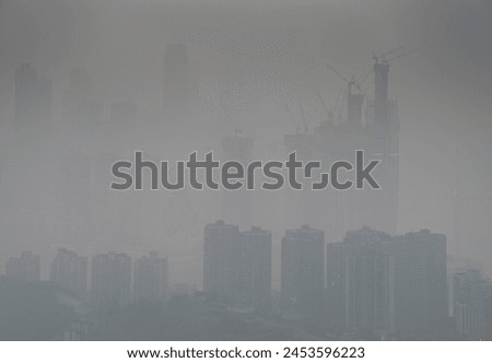 Skyline in heavy fog of the city of Chongqing under construction, Chongqing, China, Asia